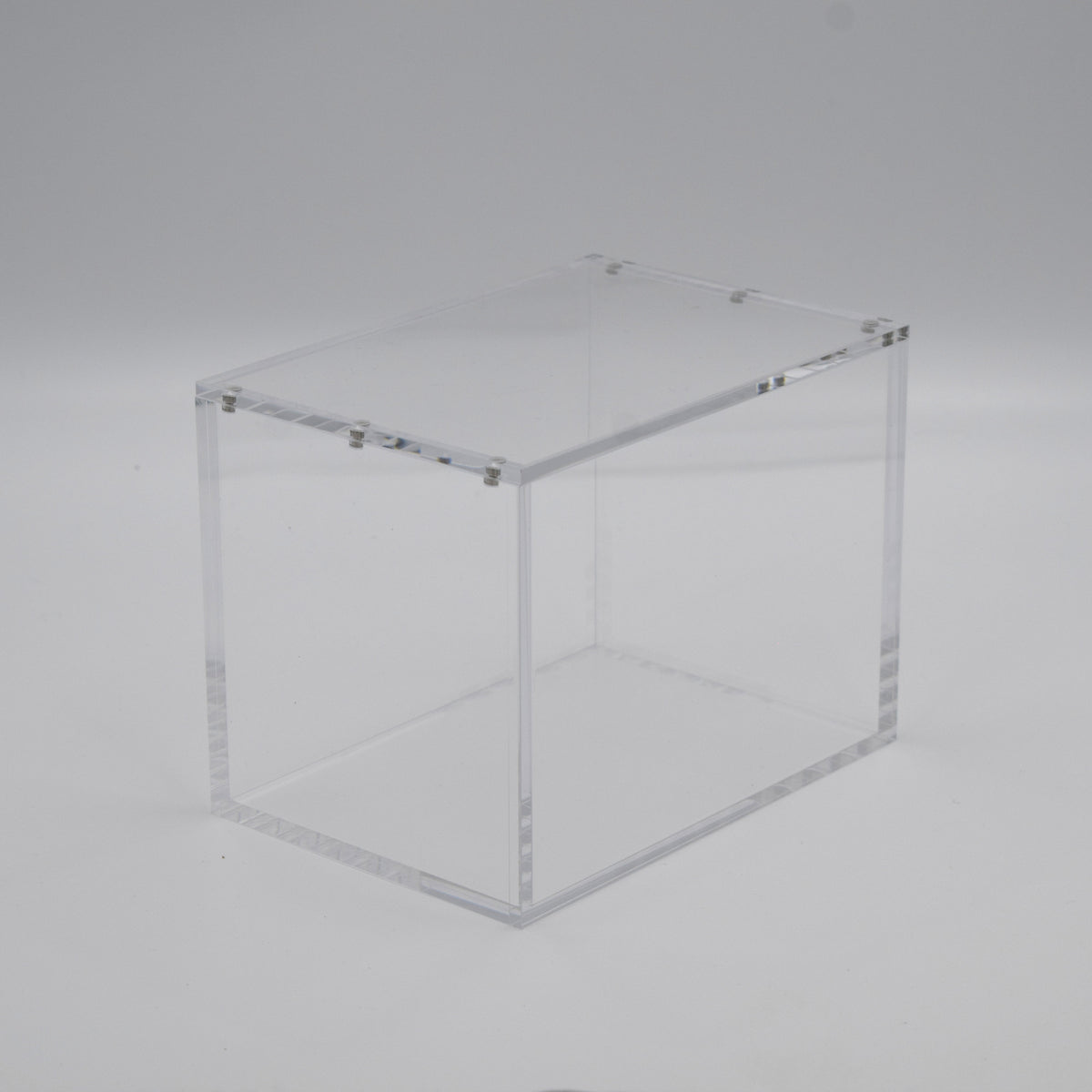 Empty 5mm acrylic case for a Pokémon Mini Tin 8-pack display with magnetic lid, angled view